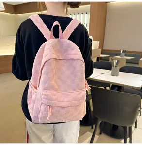 Pink checkered backpack worn by model, showing casual style and daily casual fashion look.