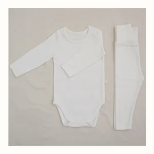 White baby long sleeve bodysuit and high waist pants set, soft cotton infant clothing.