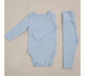 Details of light blue baby long sleeve bodysuit and high waist pants set for infants soft cotton.