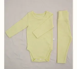 Detailed view of yellow baby long sleeve romper and high waist pants set for spring.