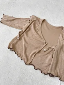 Infant ribbed long sleeve cardigan baby top with lettuce edge and cute tie details.