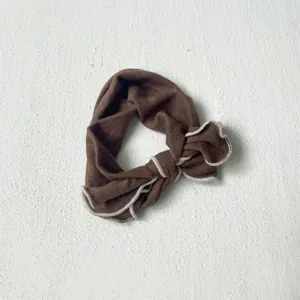 Cute brown knitted baby headband with white lettuce edge, soft hair accessory for infant daily.