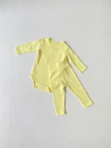 Soft yellow baby long sleeve onesie and high waist pants set, comfortable infant crawling outfit.