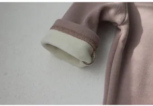 Detailed view of baby romper fleece lined cuff, soft warm fabric, fine stitching quality.