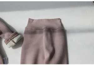 Infant high-waisted cotton blend trousers detail, soft fabric, warm lining, baby clothing.
