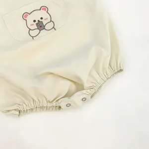 Baby romper baby jumpsuit cute bear embroidered pocket cream snap closure detail view