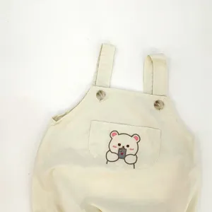 Cute baby cotton romper detail, adorable infant strap bodysuit with bear embroidery.