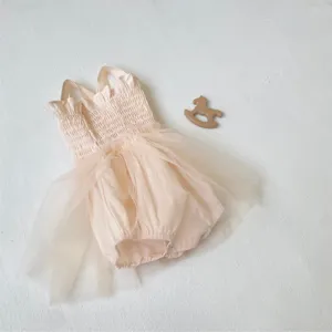 Infant baby girl summer pink smocked ruffled strap tulle dress romper detail view.