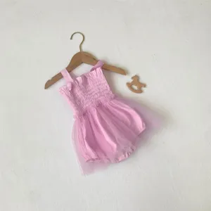 Pink baby girl mesh tutu romper detail, cute sleeveless smocked infant summer clothing.