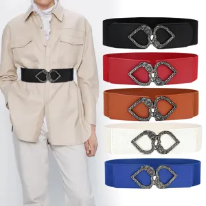 Women's elastic waist belt with retro heart buckle, stylish accessory for dresses and shirts.