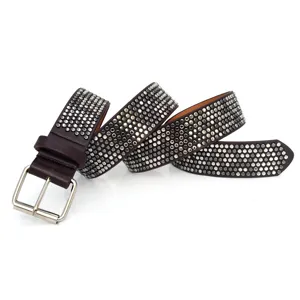 Stylish women's wide leather belt featuring dense silver rivets and a sturdy metal pin buckle.
