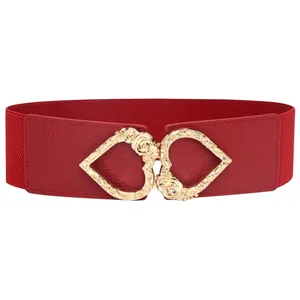 Details of women stretch red waist belt with gold heart metal buckle for dress and shirt.