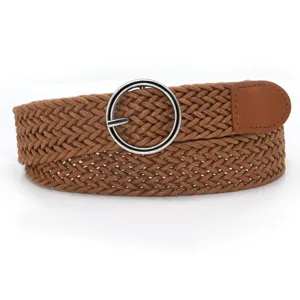 Detailed view of women braided waist belt with round metal buckle and brown finish.