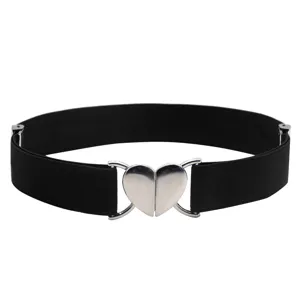 Close-up of a stylish black elastic waist belt featuring a shiny silver heart-shaped buckle.