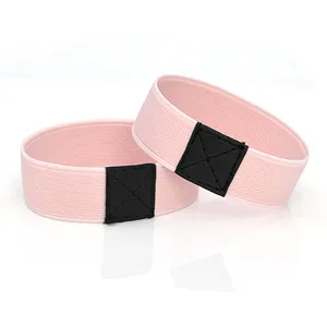 Pink elastic shoe straps for high heels, anti-slip design with black leather patch.
