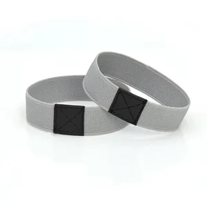 Detail of grey elastic high heel shoe straps with black patch, anti-slip shoe bands.