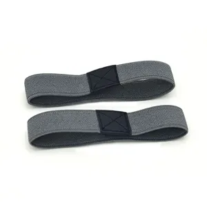 Detail view of grey elastic high heel shoe straps with black leather buckle for anti-slip.