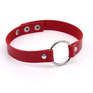Red leather punk choker detail featuring a large metal center ring and snap button closure.