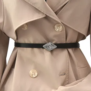 Elegant thin black leather belt with silver rhombus metal buckle for women's trench coat detail