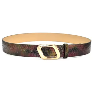 Close-up detail of the stylish snakeskin texture belt featuring unique geometric gold buckle.