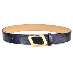 Detailed view of purple snakeskin textured leather belt featuring unique gold geometric buckle.