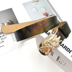 Detailed shot of a punk style colorful retro dragon head belt with snakeskin texture.