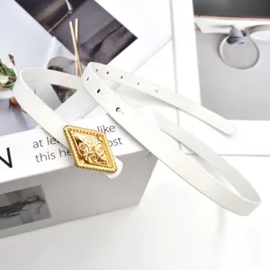 Detailed shot of a stylish white thin belt featuring a retro gold rhombus buckle, elegant.
