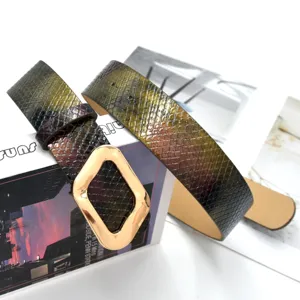 Fashion snakeskin pattern leather belt with unique gold geometric buckle for jeans.