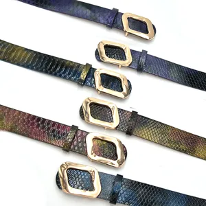 Stylish women's leather belt featuring unique geometric buckle and chic snakeskin texture design.