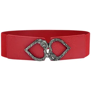Red elastic waist belt closeup, vintage silver heart rose buckle detail for dresses.