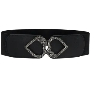 Close-up of black elastic waist belt with vintage silver double heart rose buckle.