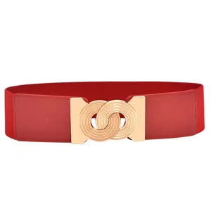 Red elastic waist belt with gold interlocking buckle, perfect for dresses and casual wear.