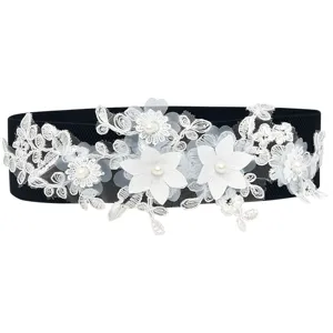 Women's black elastic waist belt featuring white floral lace embroidery and pearl decoration.