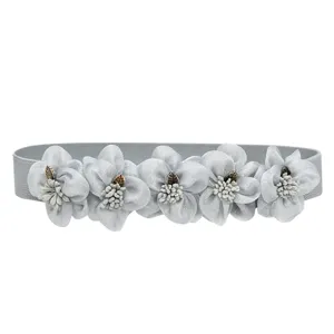 Elegant grey elastic waist belt featuring five delicate fabric flowers for dress styling.