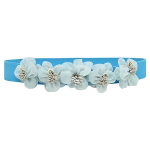 Details of the blue elastic waist belt featuring mesh fabric flowers and golden leaf charms.
