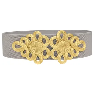 Gold woven buckle detail on wide grey elastic waist belt for women vintage styling.