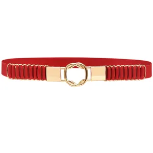 Close-up detail of the red elastic waist belt with a golden round buckle and metal rings.