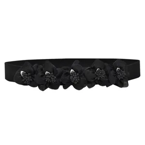 Black elastic waist belt with floral decor for women, stylish dress accessory cincher.