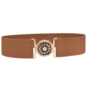 Women's brown elastic waist belt with gold metal interlocking buckle and black floral design.