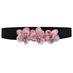 Women's rhinestone elastic waist belt detail view, sweet pink flower dress accessory.