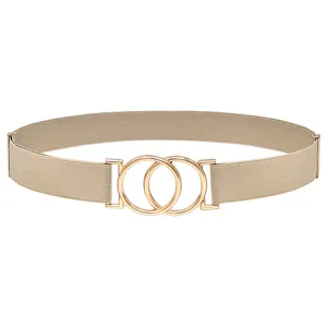 Detail shot of beige elastic belt with gold interlocking double ring buckle for women waist.