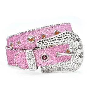 Rhinestone pink belt detail showing sparkly sequins, metal grommets, and studded skull buckle.