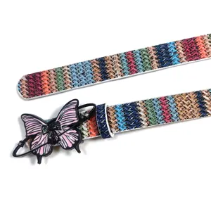 Detailed view of the colorful woven y2k belt featuring a unique pink and black butterfly buckle.