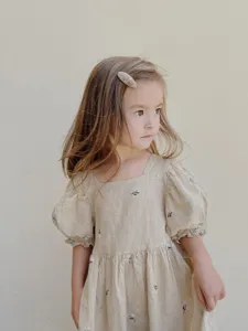 Toddler girls summer embroidered dress with square neck and puff sleeves, beige woven cotton.