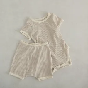 Baby cotton ribbed short sleeve romper and shorts set, cute infant summer outfit details.