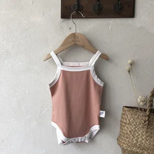 Cute baby summer strap romper, comfortable pink cotton baby onesie with stylish white trim.
