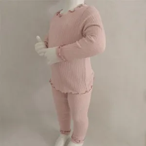 Pink ribbed baby long sleeve top and pants set featuring cute lettuce edge trim for daily wear.
