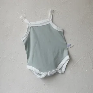 Summer baby strap romper, light green cotton onesie with white trim for infants.