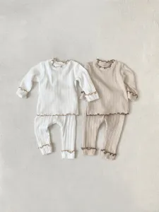 Infant baby ribbed long-sleeve top and leggings set with cute lettuce trim details.