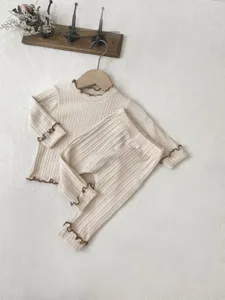Cozy ribbed baby long sleeve t-shirt and leggings set with cute contrast lettuce edge.
